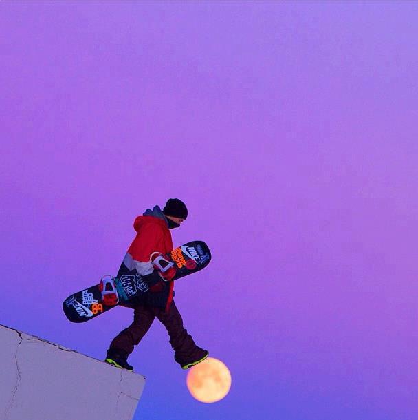 snowboarder walking on moon